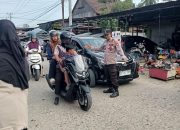 Polsek Tapango Laksanakan Pengamanan dan Pengaturan Arus Lalu Lintas di Pasar Pelitakan