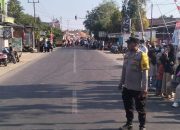 Meriahkan HUT RI ke-81, Bhabinkamtibmas Amankan Gerak Jalan Se-Kelurahan Pappang